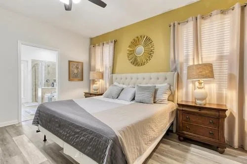 Primary bedroom with upholstered headboard