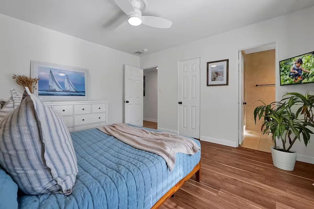 Neatly made bed in a bright bedroom