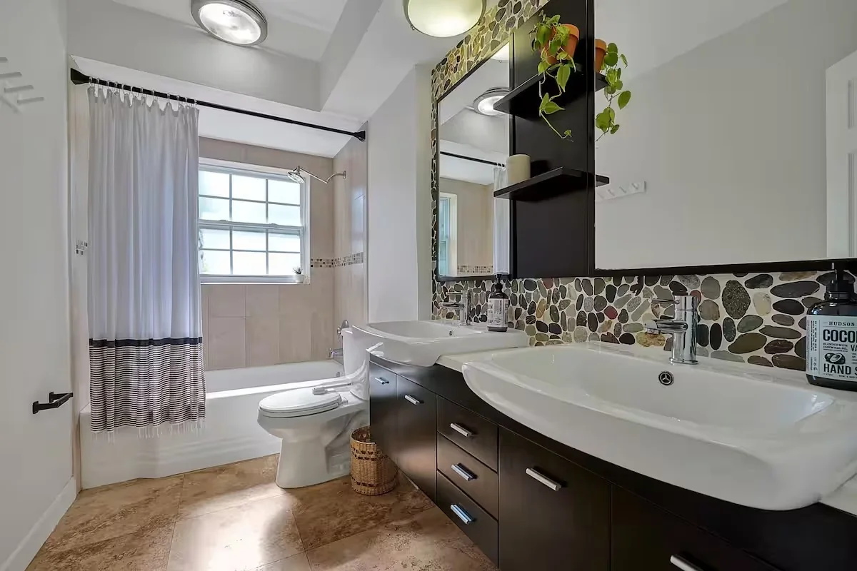 Spotless bathroom with vanity and mirror